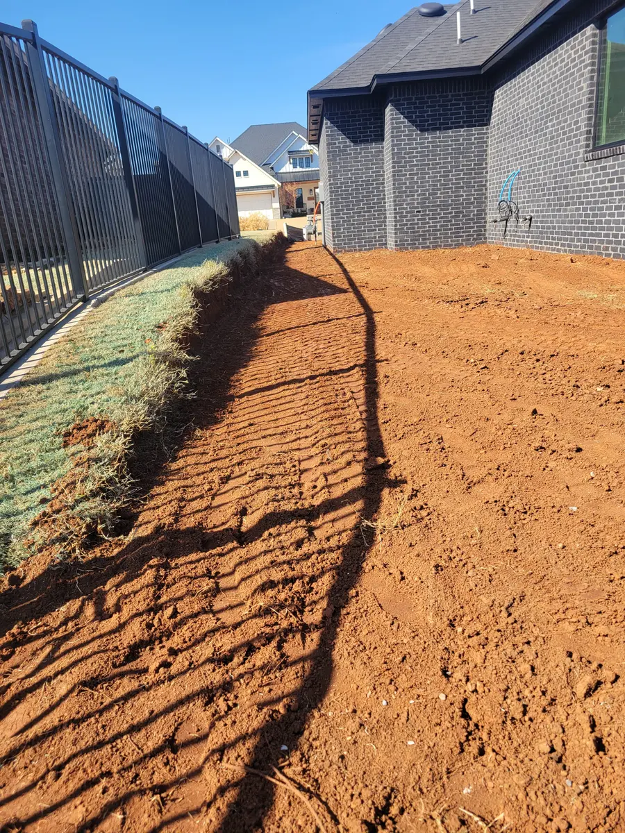 Fresh finish grade meeting a new sod edge